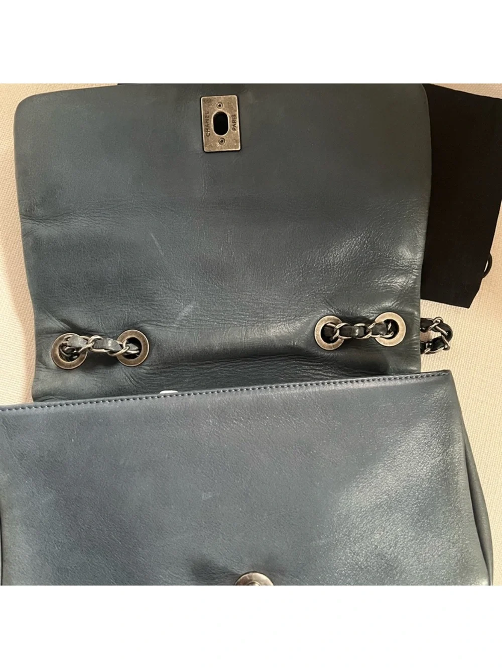 CHANEL Black Quilted Lambskin Shoulder Bag with Silver CC Lock.
